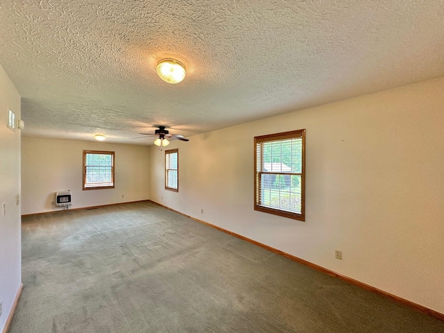 7532 Maysville Rd, Carlisle, KY 40311 - unfurnished room with heating unit, a ceiling fan, carpet floors, baseboards, and a textured ceiling