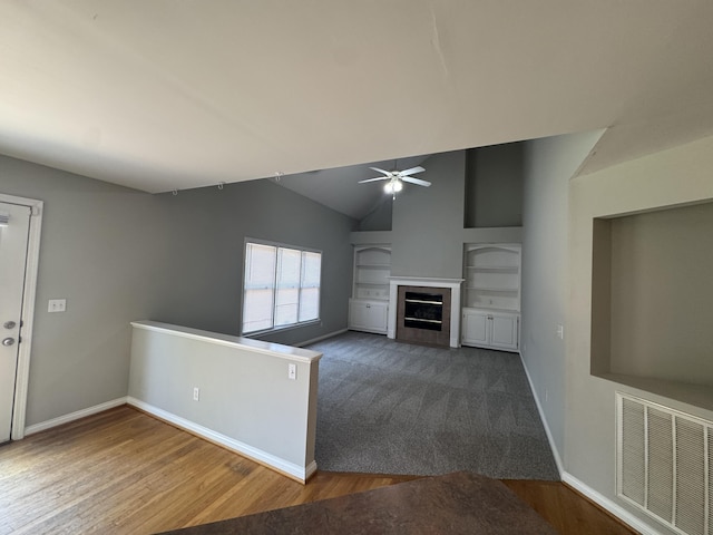3017 Polo Club Blvd, Lexington, KY 40509 - unfurnished living room featuring a ceiling fan, baseboards, wood finished floors, a tile fireplace, and lofted ceiling