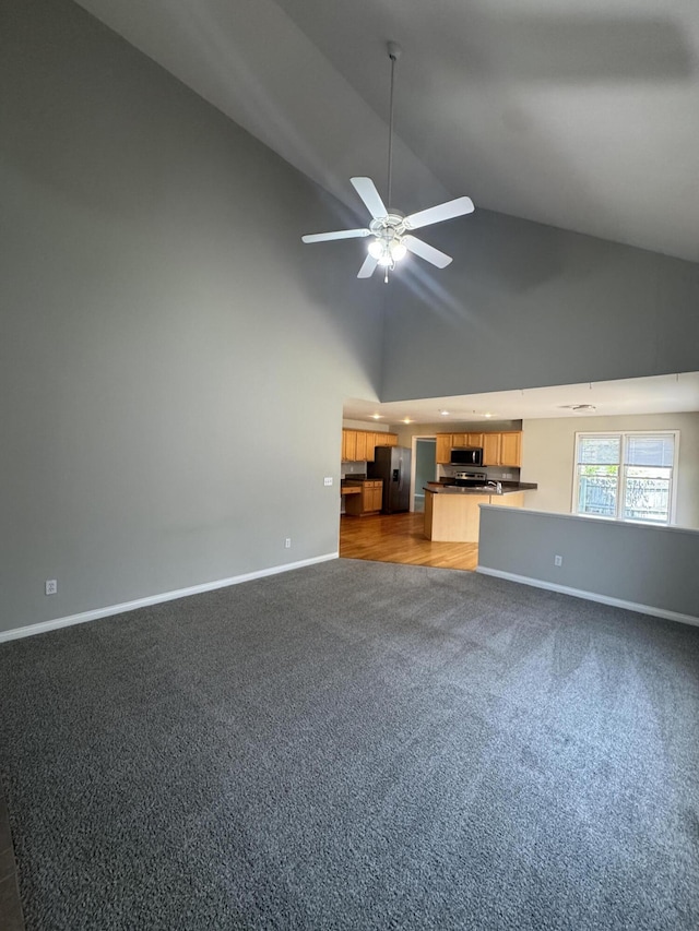 3017 Polo Club Blvd, Lexington, KY 40509 - unfurnished living room with carpet floors, baseboards, high vaulted ceiling, and ceiling fan