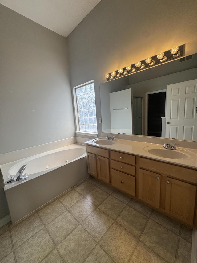 3017 Polo Club Blvd, Lexington, KY 40509 - bathroom featuring double vanity, a whirlpool tub, and tile patterned flooring