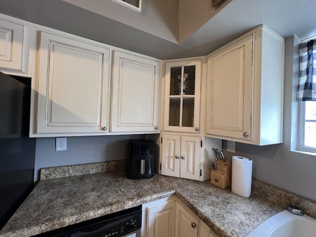 104 Steele St, Corbin, KY 40701 - kitchen featuring dishwashing machine, freestanding refrigerator, glass insert cabinets, and a sink