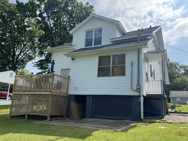 104 Steele St, Corbin, KY 40701 - rear view of property featuring a yard, a deck, an attached garage, and roof with shingles