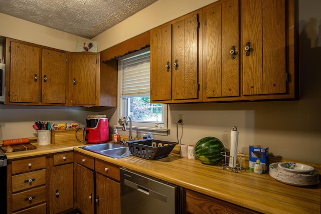 1540 Stoney Fork Rd, Corbin, KY 40701 - kitchen with stainless steel dishwasher, a sink, light countertops, brown cabinets, and a textured ceiling