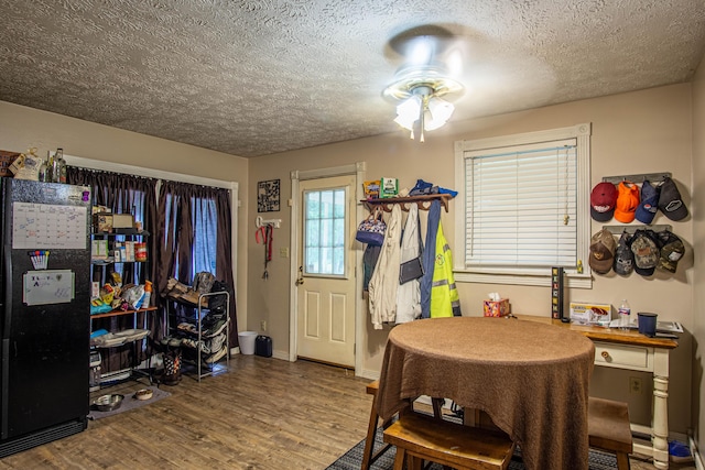 1540 Stoney Fork Rd, Corbin, KY 40701 - dining area with a textured ceiling, a ceiling fan, wood finished floors, and baseboards