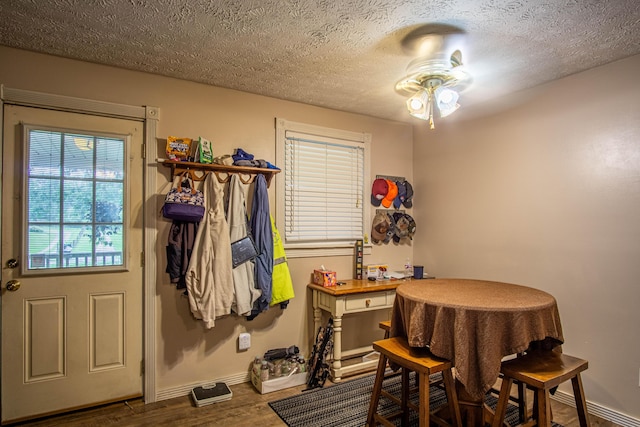 1540 Stoney Fork Rd, Corbin, KY 40701 - dining area featuring a ceiling fan, baseboards, wood finished floors, and a textured ceiling