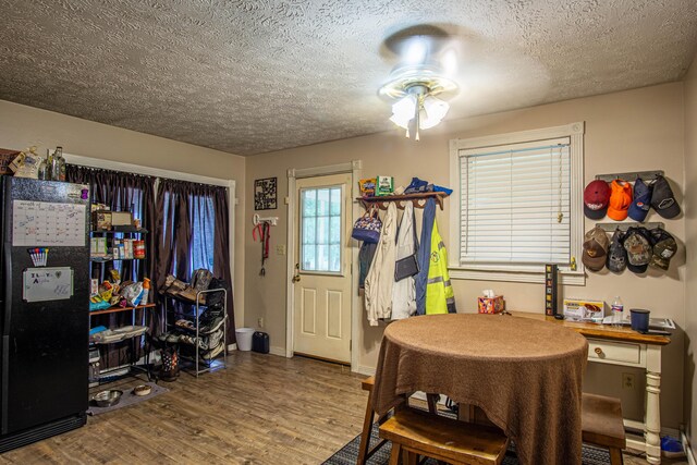 1540 Stoney Fork Rd, Corbin, KY 40701 - dining room featuring a textured ceiling, a ceiling fan, and wood finished floors