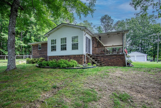 1540 Stoney Fork Rd, Corbin, KY 40701 - view of front of home with stairs, a garage, a wooden deck, an outbuilding, and brick siding
