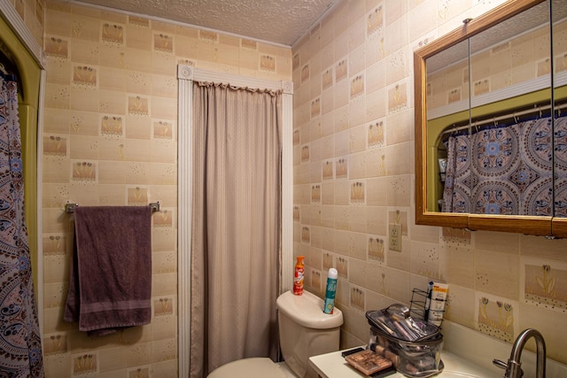 1540 Stoney Fork Rd, Corbin, KY 40701 - bathroom with toilet, a textured ceiling, and tile walls