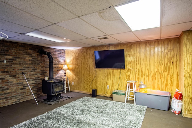 1540 Stoney Fork Rd, Corbin, KY 40701 - finished below grade area with a wood stove, a paneled ceiling, and wood walls