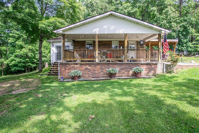 1540 Stoney Fork Rd, Corbin, KY 40701 - view of front of house featuring a porch, a front lawn, brick siding, and stairs