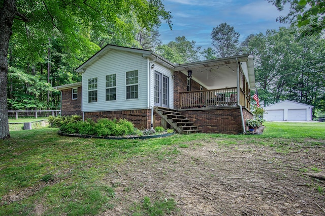 1540 Stoney Fork Rd, Corbin, KY 40701 - view of front of home with stairs, a detached garage, an outdoor structure, and brick siding