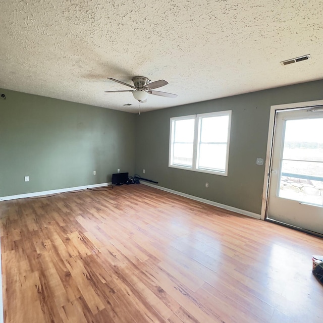 630 Blakely Rd, London, KY 40744 - spare room featuring wood finished floors, a ceiling fan, a textured ceiling, and baseboards