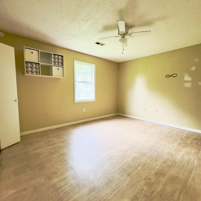 630 Blakely Rd, London, KY 40744 - empty room featuring a ceiling fan, wood finished floors, a textured ceiling, and baseboards