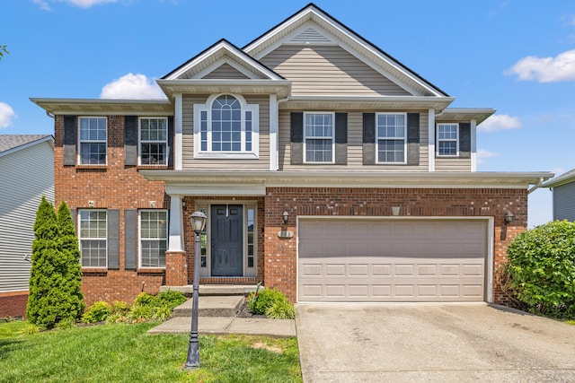 962 Cobble Dr, Richmond, KY 40475 - view of front facade featuring brick siding, concrete driveway, and a garage