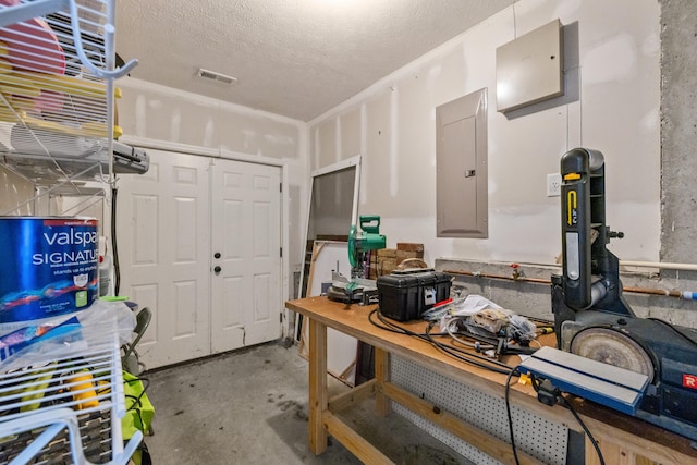 962 Cobble Dr, Richmond, KY 40475 - miscellaneous room featuring electric panel, concrete floors, and a textured ceiling