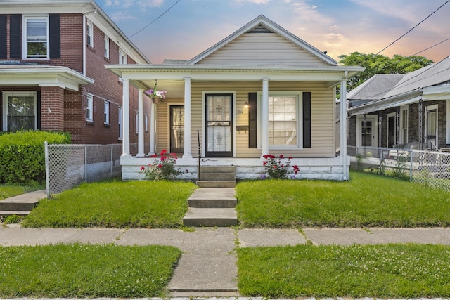 522 Atwood St, Louisville, KY 40217 - view of front facade with a porch