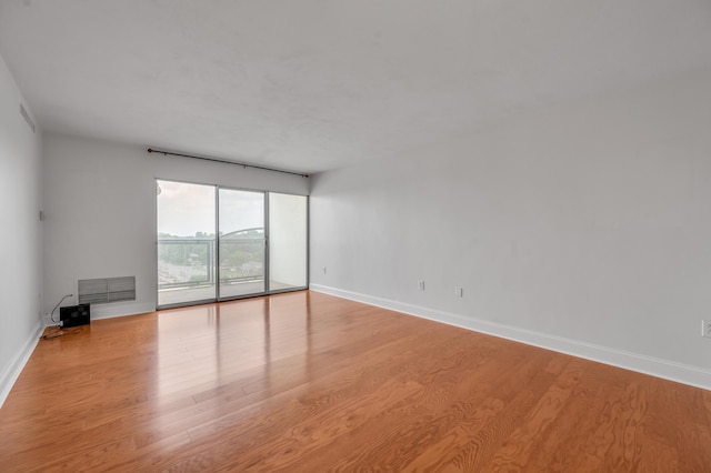 2121 Nicholasville Rd Unit 910, Lexington, KY 40503 - unfurnished room with baseboards and light wood-style flooring