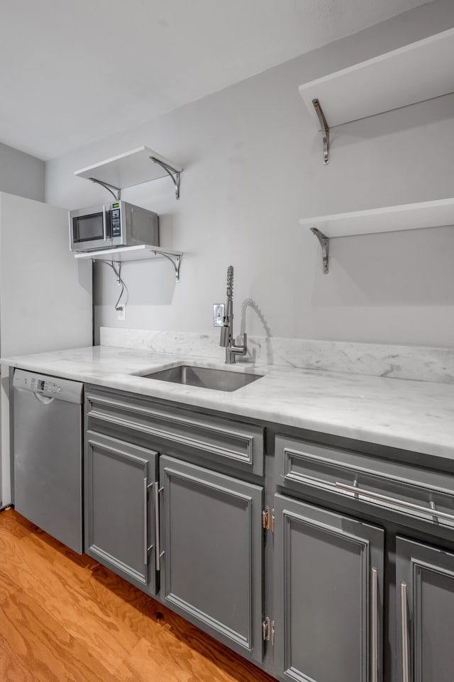 2121 Nicholasville Rd Unit 910, Lexington, KY 40503 - kitchen with open shelves, stainless steel appliances, and gray cabinetry