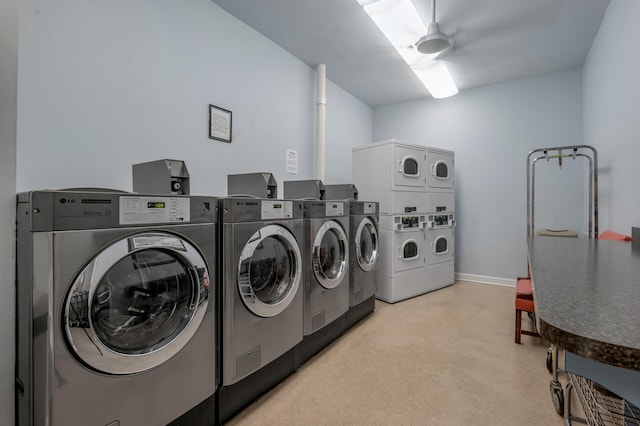 2121 Nicholasville Rd Unit 910, Lexington, KY 40503 - community laundry featuring stacked washer / dryer, washer and clothes dryer, and baseboards