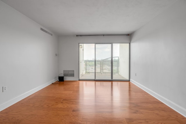 2121 Nicholasville Rd Unit 910, Lexington, KY 40503 - unfurnished room featuring wood finished floors and baseboards