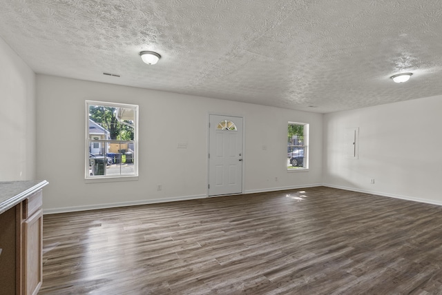 330 Corral St, Lexington, KY 40508 - unfurnished living room with a textured ceiling and dark wood-style flooring