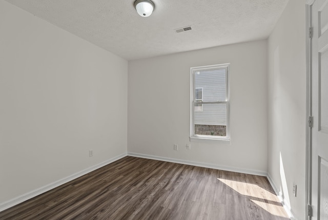 330 Corral St, Lexington, KY 40508 - empty room with dark wood-style floors and a textured ceiling