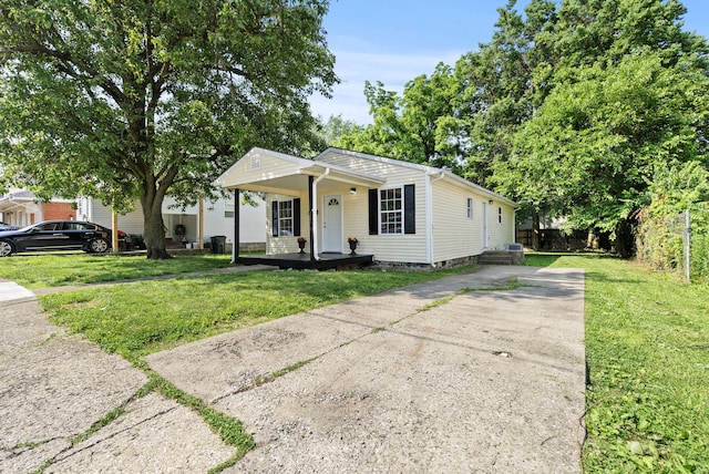 330 Corral St, Lexington, KY 40508 - view of front of home with a porch, a front lawn, and driveway