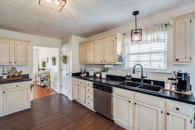 105 Geneva Ct, Nicholasville, KY 40356 - kitchen with dishwasher, a sink, dark countertops, dark wood-style flooring, and cream cabinetry