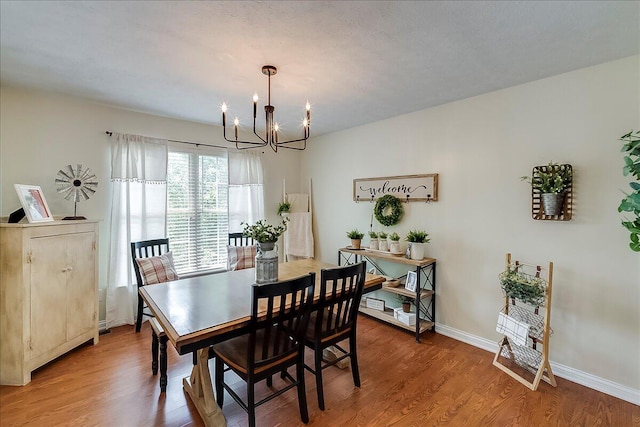 105 Geneva Ct, Nicholasville, KY 40356 - dining space with a chandelier, light wood-style floors, and baseboards