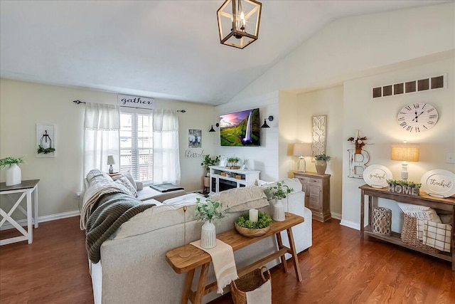 105 Geneva Ct, Nicholasville, KY 40356 - living area featuring vaulted ceiling, wood finished floors, baseboards, and a chandelier
