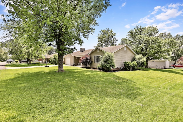 400 Aspen Dr, Lawrenceburg, KY 40342 - view of side of property with an attached garage, a chimney, and a yard