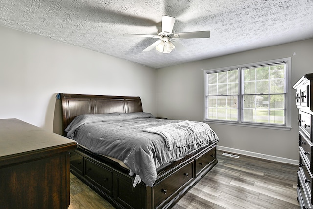 400 Aspen Dr, Lawrenceburg, KY 40342 - bedroom with a textured ceiling, dark wood-style flooring, and ceiling fan