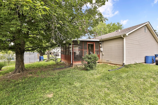 400 Aspen Dr, Lawrenceburg, KY 40342 - view of front facade with a sunroom, a front lawn, a shingled roof, and a storage unit
