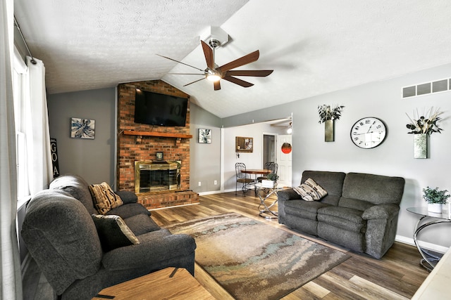 400 Aspen Dr, Lawrenceburg, KY 40342 - living room featuring ceiling fan, wood finished floors, a fireplace, lofted ceiling, and a textured ceiling
