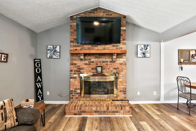 400 Aspen Dr, Lawrenceburg, KY 40342 - living area featuring lofted ceiling, wood finished floors, and a textured ceiling