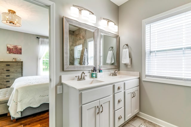 109 Palumbo Pl, Georgetown, KY 40324 - bathroom with double vanity, baseboards, tiled shower, and ensuite bathroom