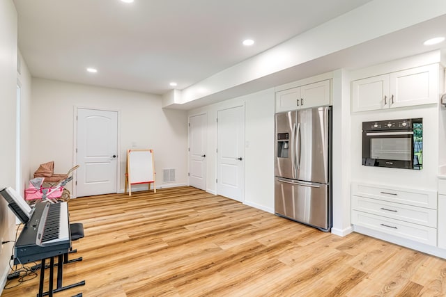 109 Palumbo Pl, Georgetown, KY 40324 - kitchen with stainless steel fridge with ice dispenser, oven, light wood-style flooring, recessed lighting, and white cabinets