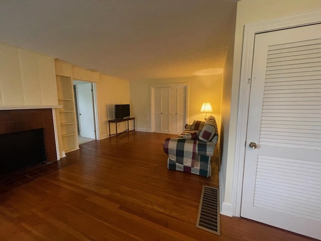 411 Ohara Dr, Danville, KY 40422 - living area featuring dark wood-style flooring and a fireplace