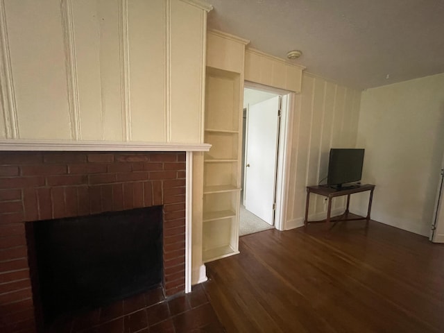 411 Ohara Dr, Danville, KY 40422 - unfurnished living room featuring a brick fireplace and dark wood-type flooring