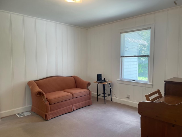 411 Ohara Dr, Danville, KY 40422 - living area with a decorative wall, carpet flooring, and crown molding
