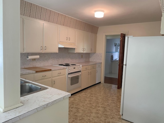 411 Ohara Dr, Danville, KY 40422 - kitchen featuring white appliances, light countertops, backsplash, and light flooring