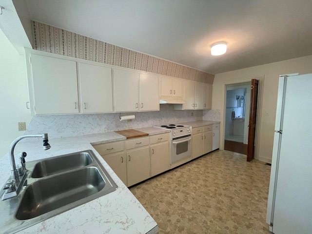 411 Ohara Dr, Danville, KY 40422 - kitchen featuring white appliances, light flooring, light countertops, under cabinet range hood, and white cabinetry