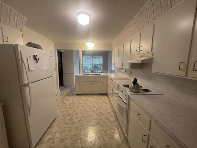 411 Ohara Dr, Danville, KY 40422 - kitchen with white appliances, under cabinet range hood, light countertops, a peninsula, and white cabinets