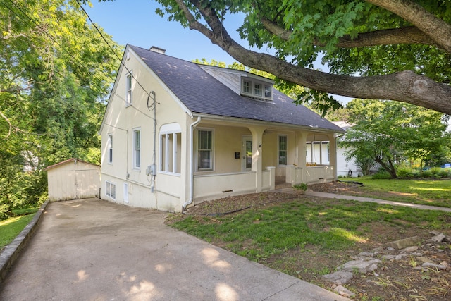611 Old Shakertown Rd, Danville, KY 40422 - view of front facade with a porch, a shingled roof, an outdoor structure, and stucco siding