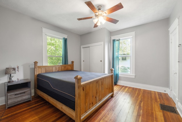 611 Old Shakertown Rd, Danville, KY 40422 - bedroom with baseboards, hardwood / wood-style floors, a closet, and a ceiling fan