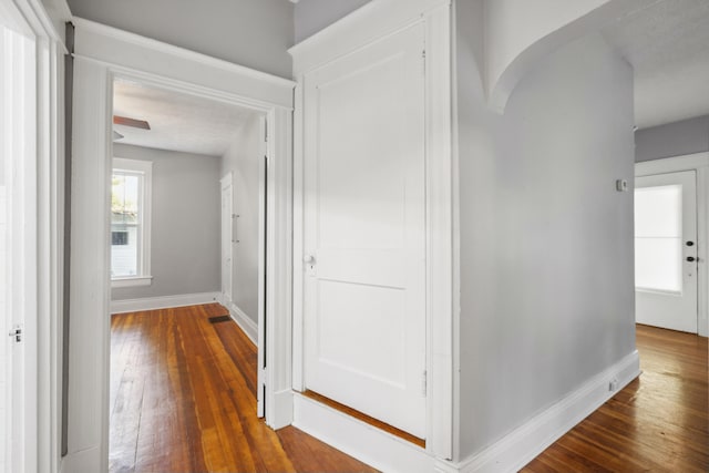 611 Old Shakertown Rd, Danville, KY 40422 - hallway featuring dark wood-style floors, arched walkways, and baseboards