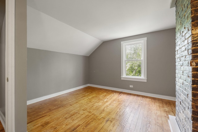 611 Old Shakertown Rd, Danville, KY 40422 - additional living space with light wood-style floors, vaulted ceiling, and baseboards
