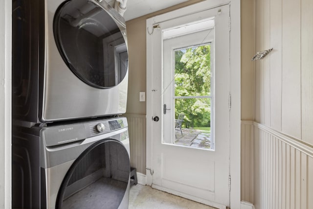 611 Old Shakertown Rd, Danville, KY 40422 - laundry room with stacked washer / dryer, a decorative wall, and wainscoting