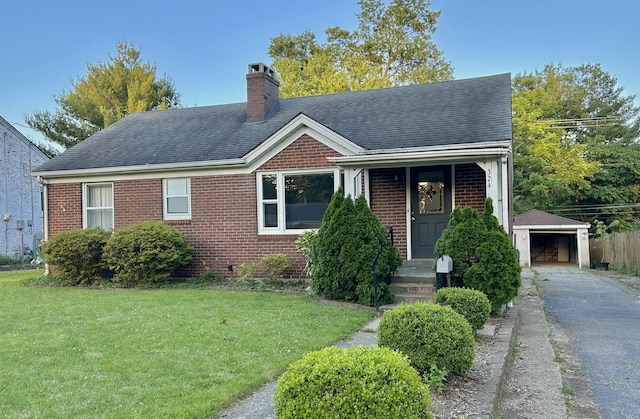 324 Glendale Ave, Lexington, KY 40511 - view of front facade with a front lawn, brick siding, a chimney, an outdoor structure, and a shingled roof