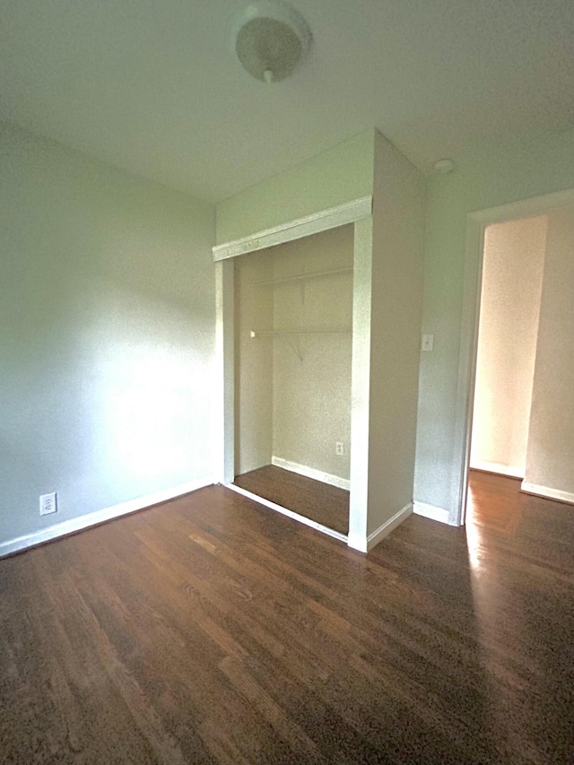 324 Glendale Ave, Lexington, KY 40511 - unfurnished bedroom featuring wood finished floors, baseboards, and a closet